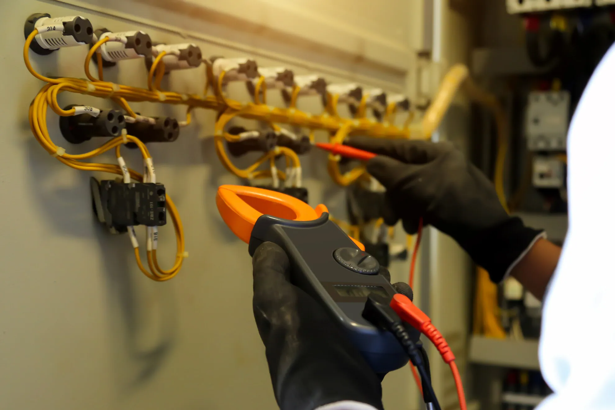 Close up hand electrical engineering using measuring checking electricity